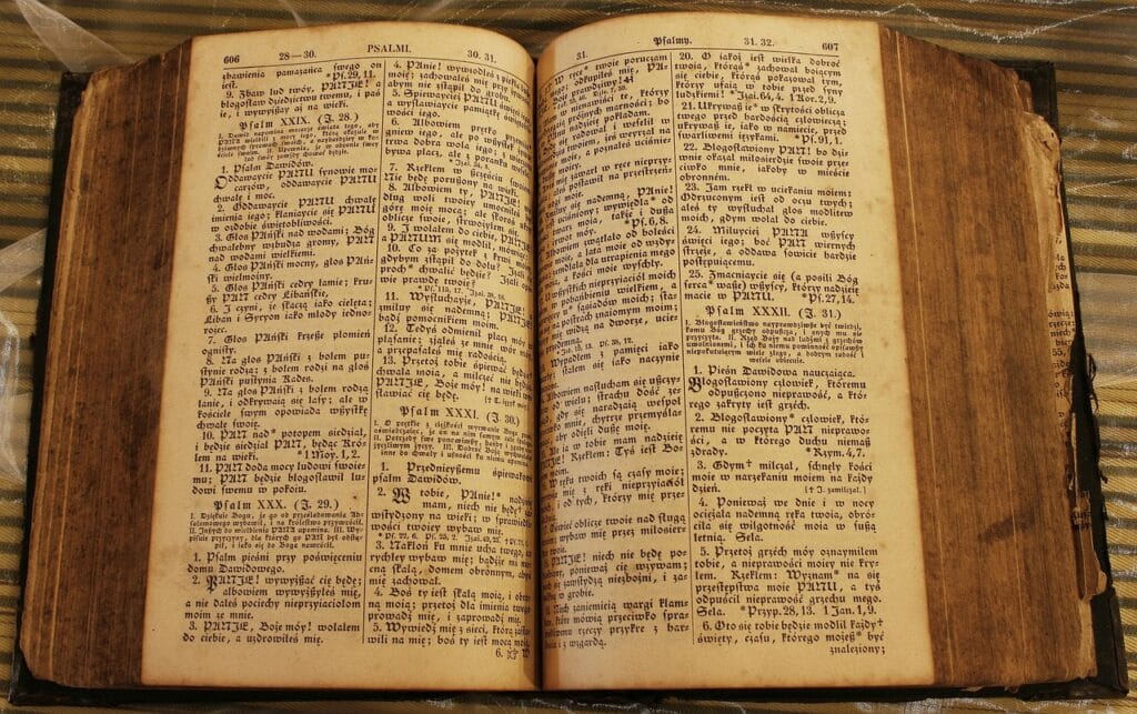 Open Bible with divine light symbolizing God’s plan in The Old Testament